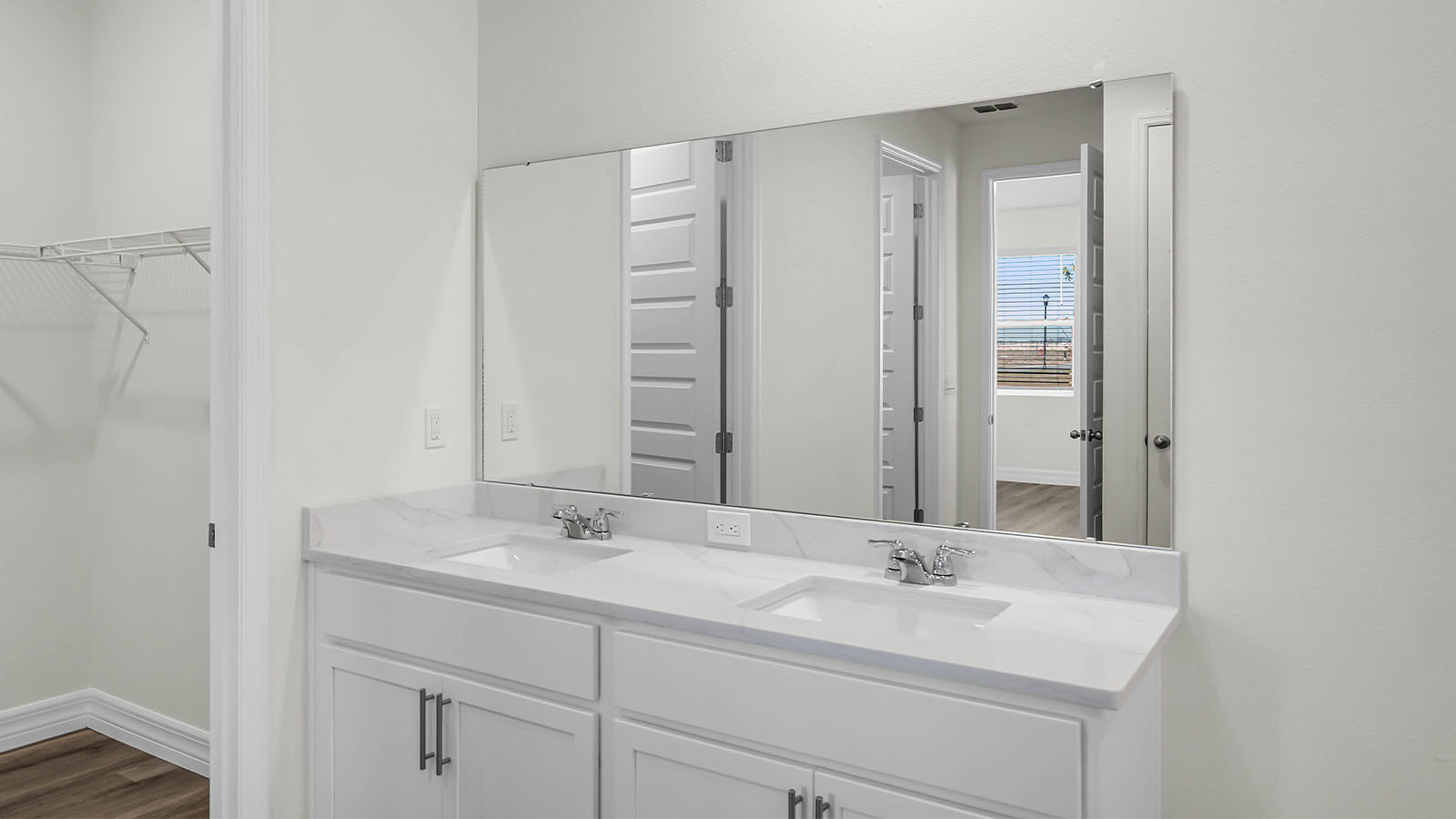 primary bathroom with double vanity sink