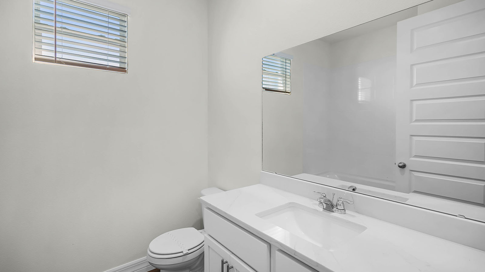 guest bathroom with sink and mirror