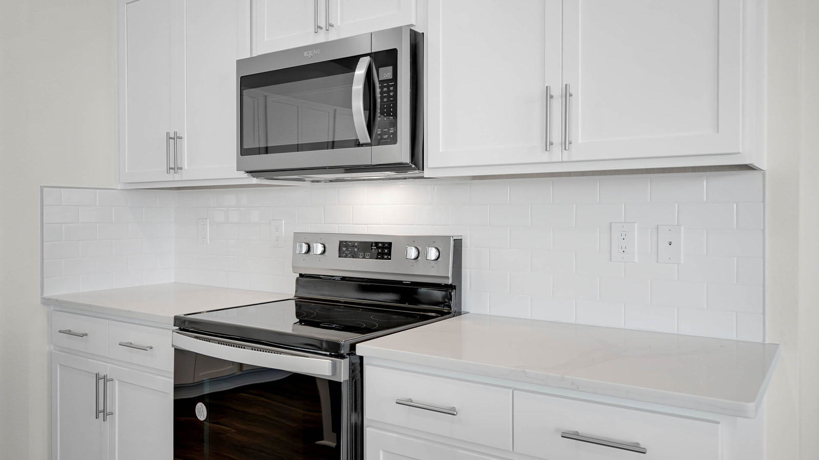 kitchen showing microwave and range