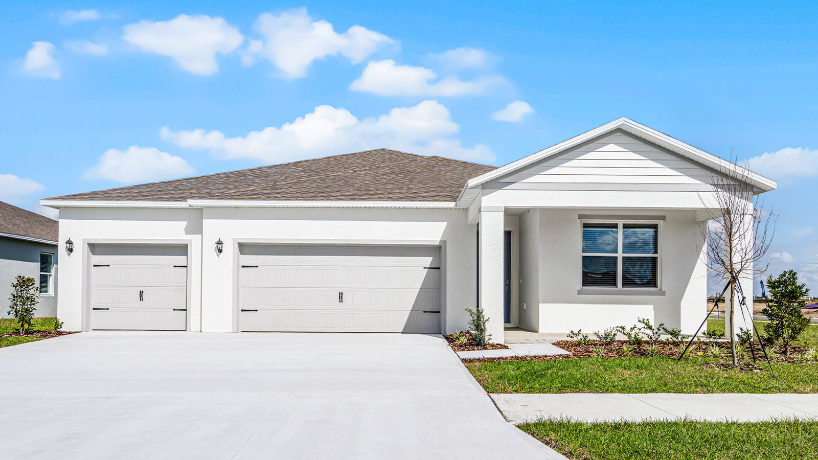 Exterior single family home with two car garage