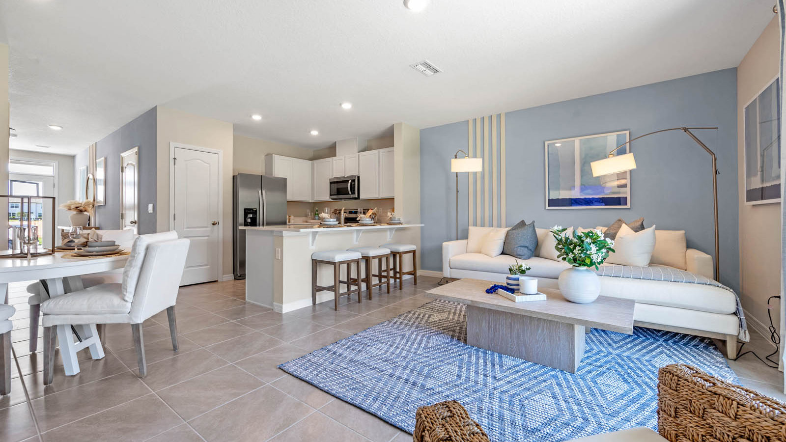 Open concept main floor with spacious living room, dining room, and kitchen