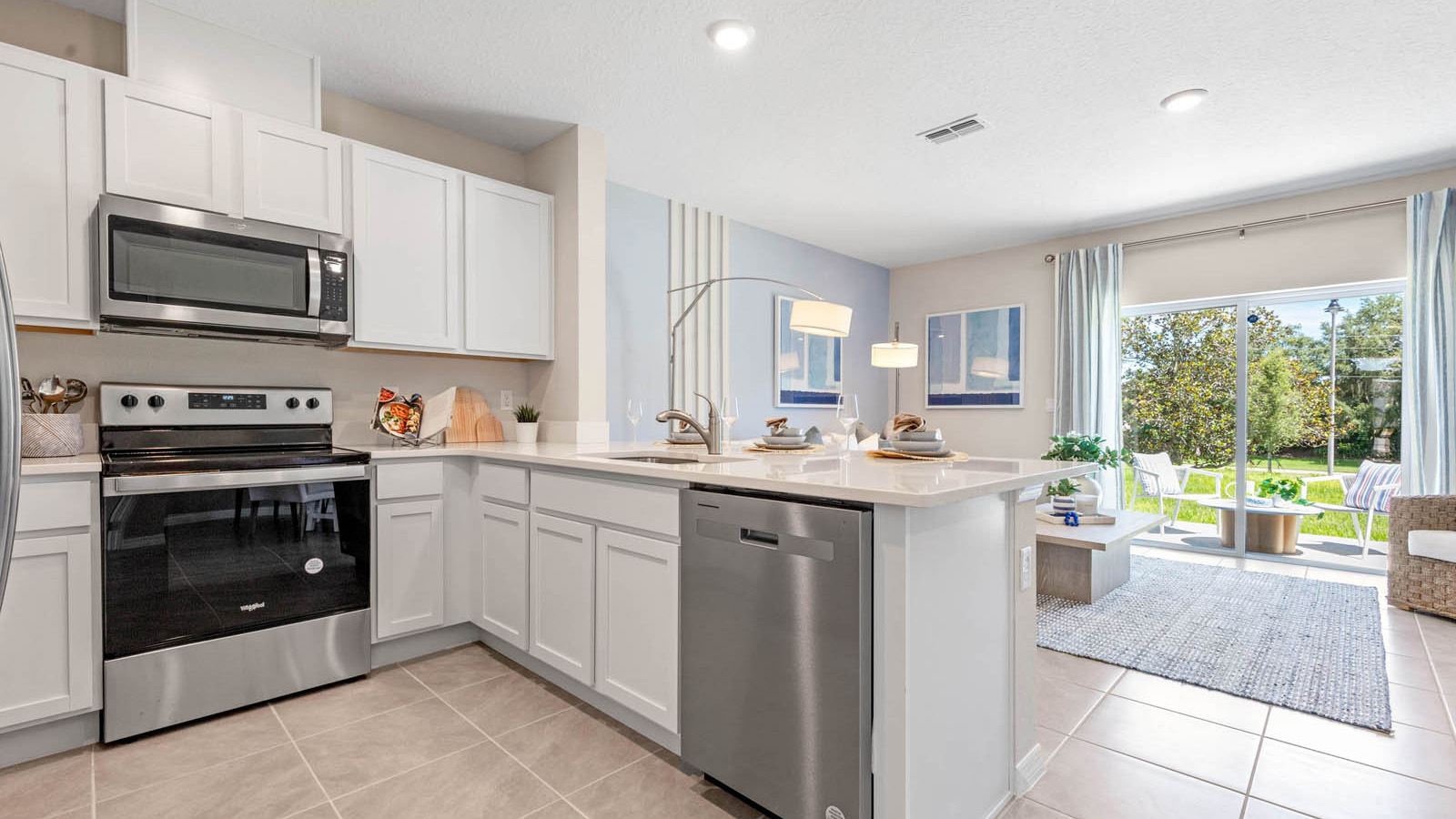 Open concept kitchen with peninsula overlooking living room