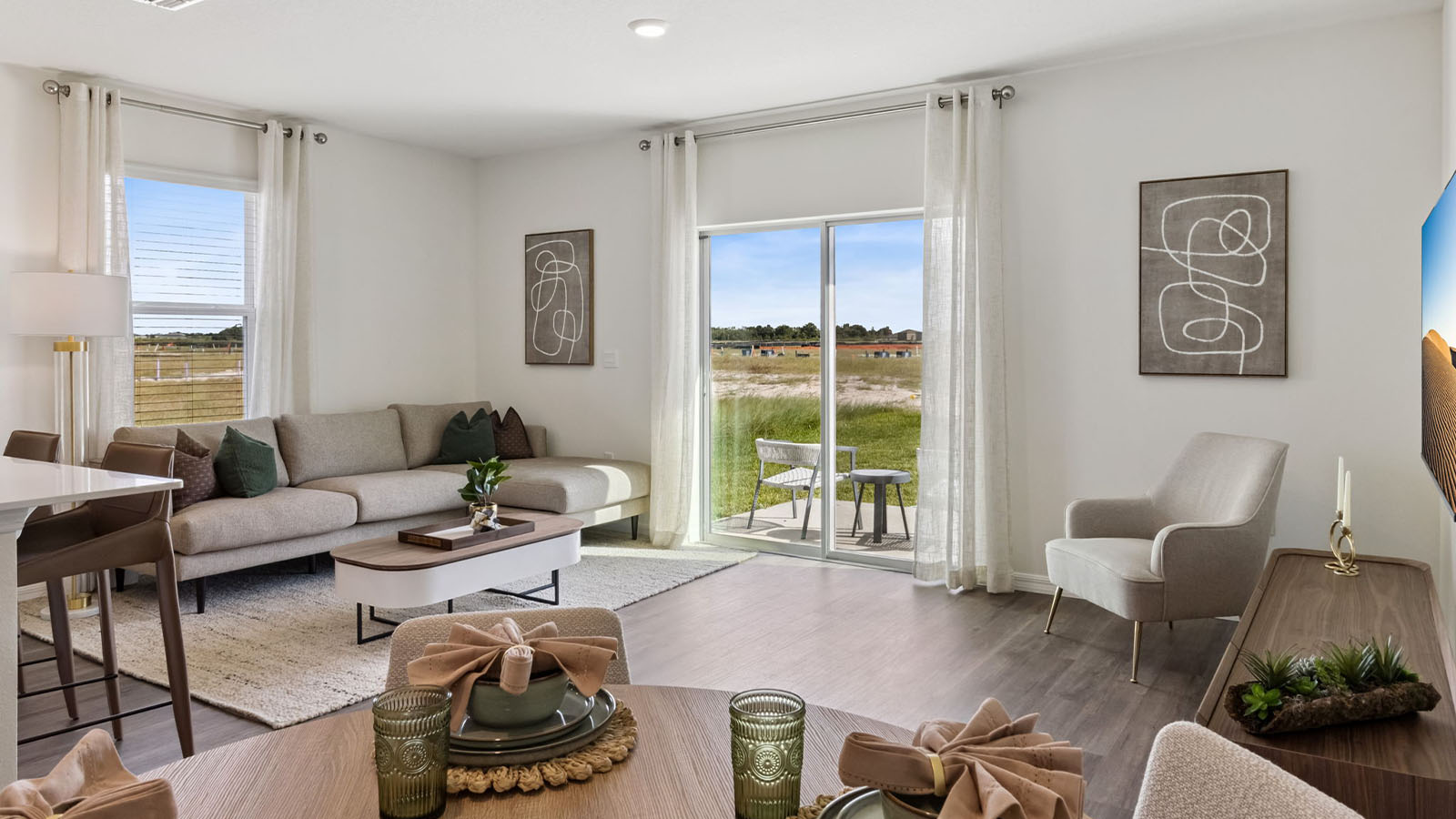 Living Room with sectional couch and view of back patio
