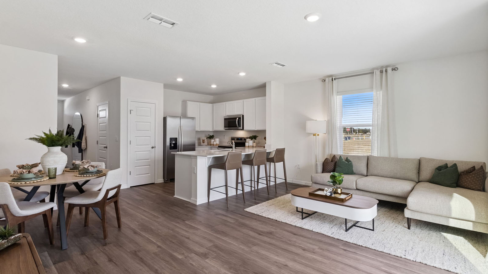 Open concept living room with luxury vinyl planks
