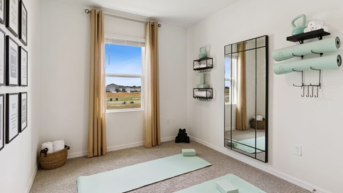 guest bedroom as a yoga room with carpet