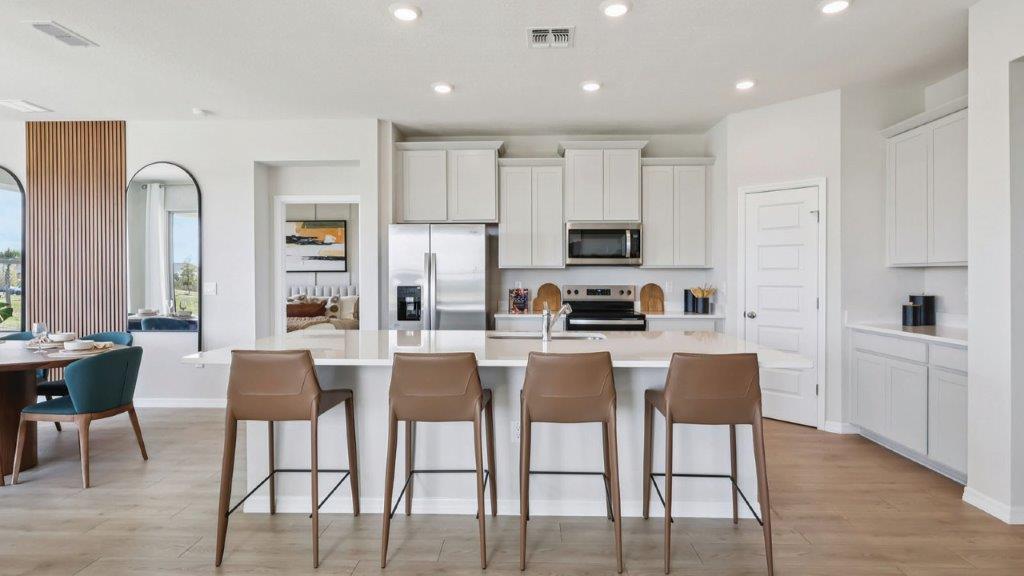 kitchen with island and 4 barstools