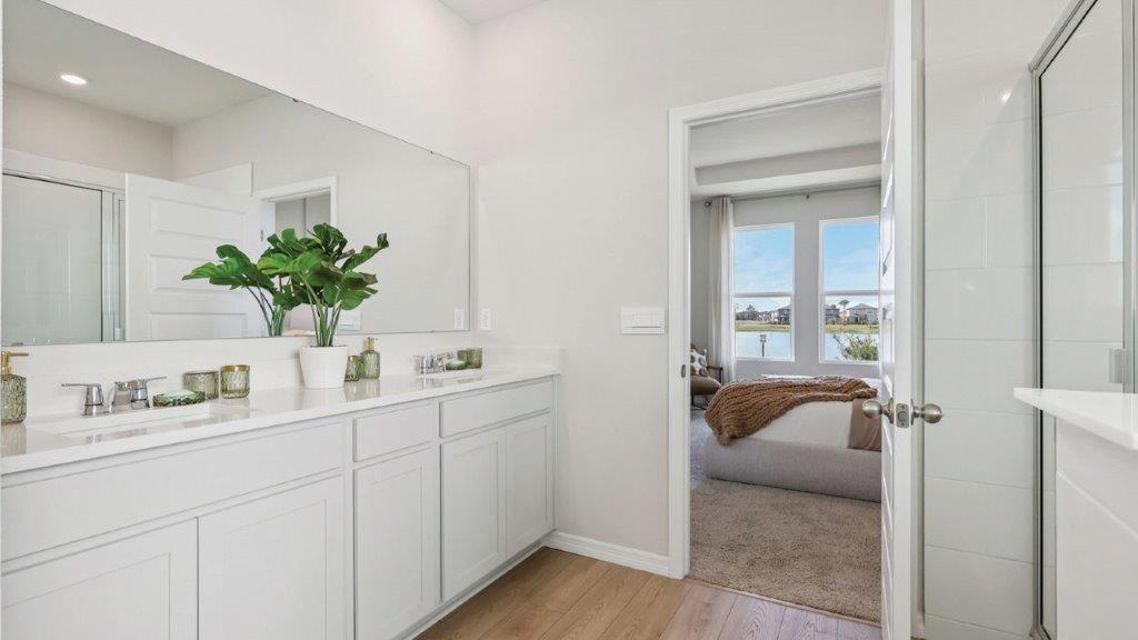 primary bathroom with dual vanity sink