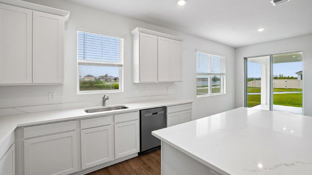 Kitchen island view with a small window in the kitchen