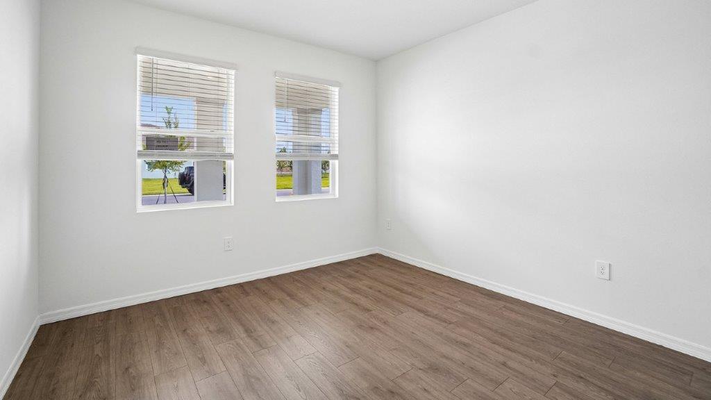 Downstairs bedroom with two windows