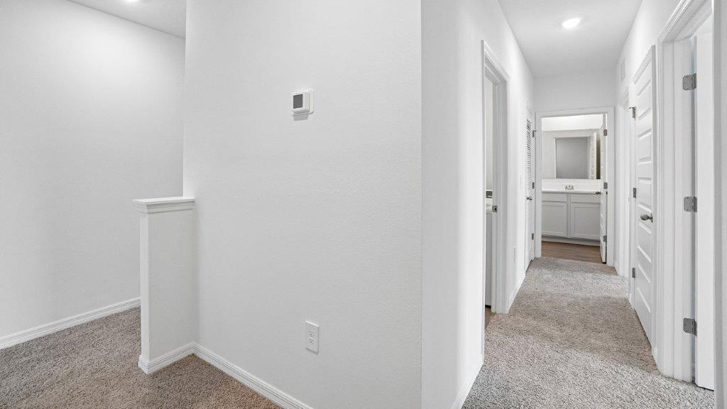 Upstairs hallway with carpet