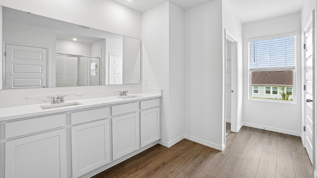 Primary bathroom with luxury vinyl planks