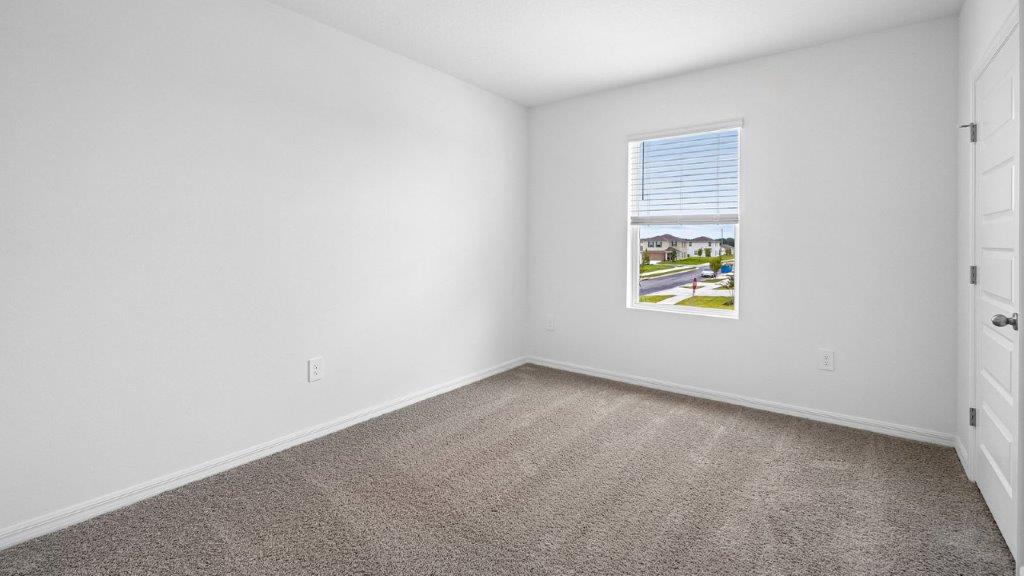 Guest bedroom with carpet throughout