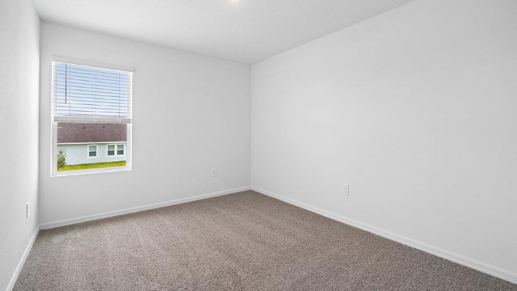 Guest bedroom with carpet throughout