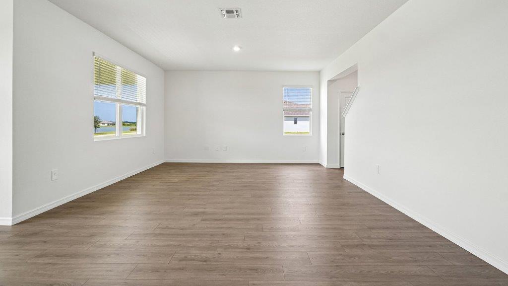 Spacious living room with multiple windows