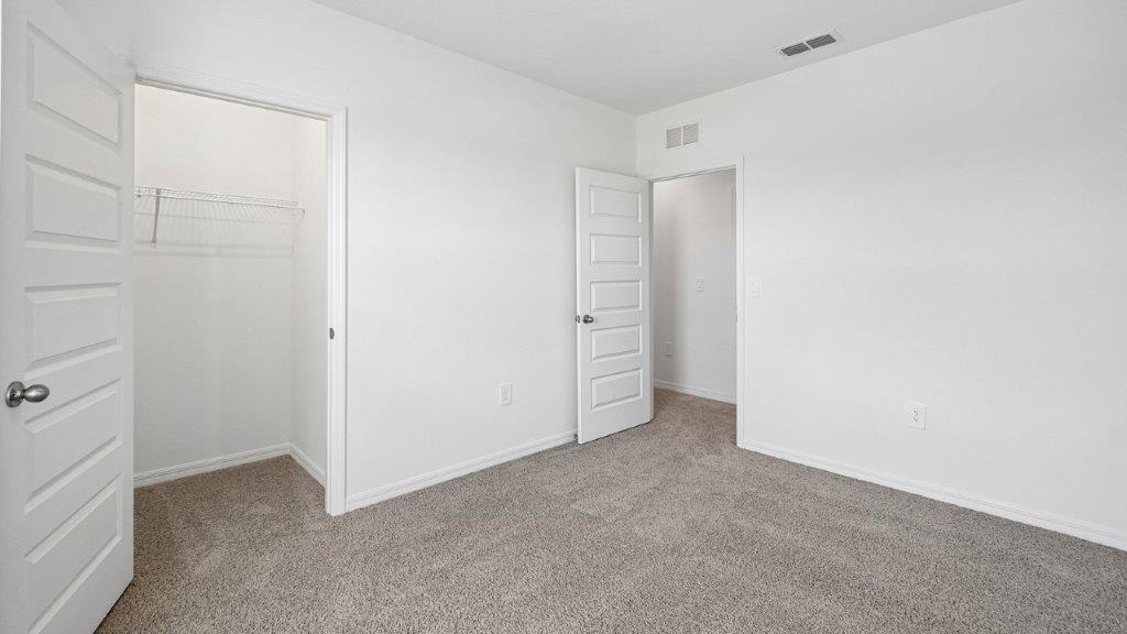 Guest bedroom with carpet throughout