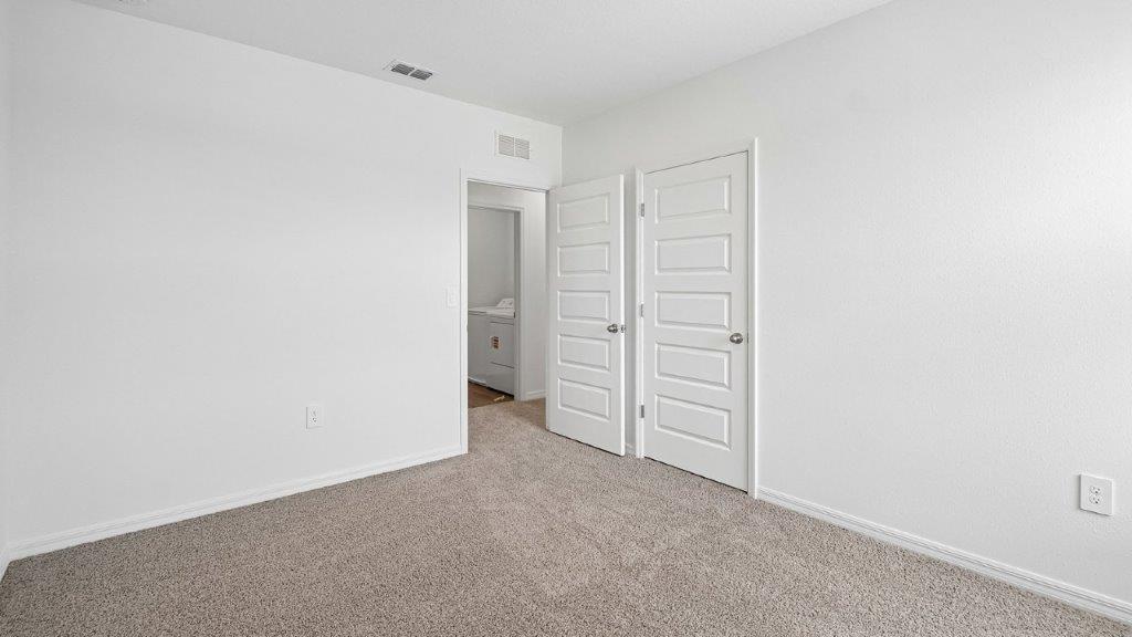 Guest bedroom with carpet throughout