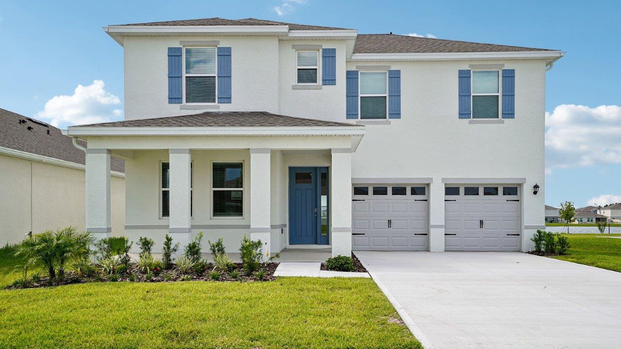 Exterior single family home with two car garage and a front porch