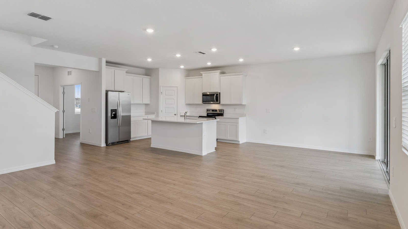 Living room, kitchen, and dining area