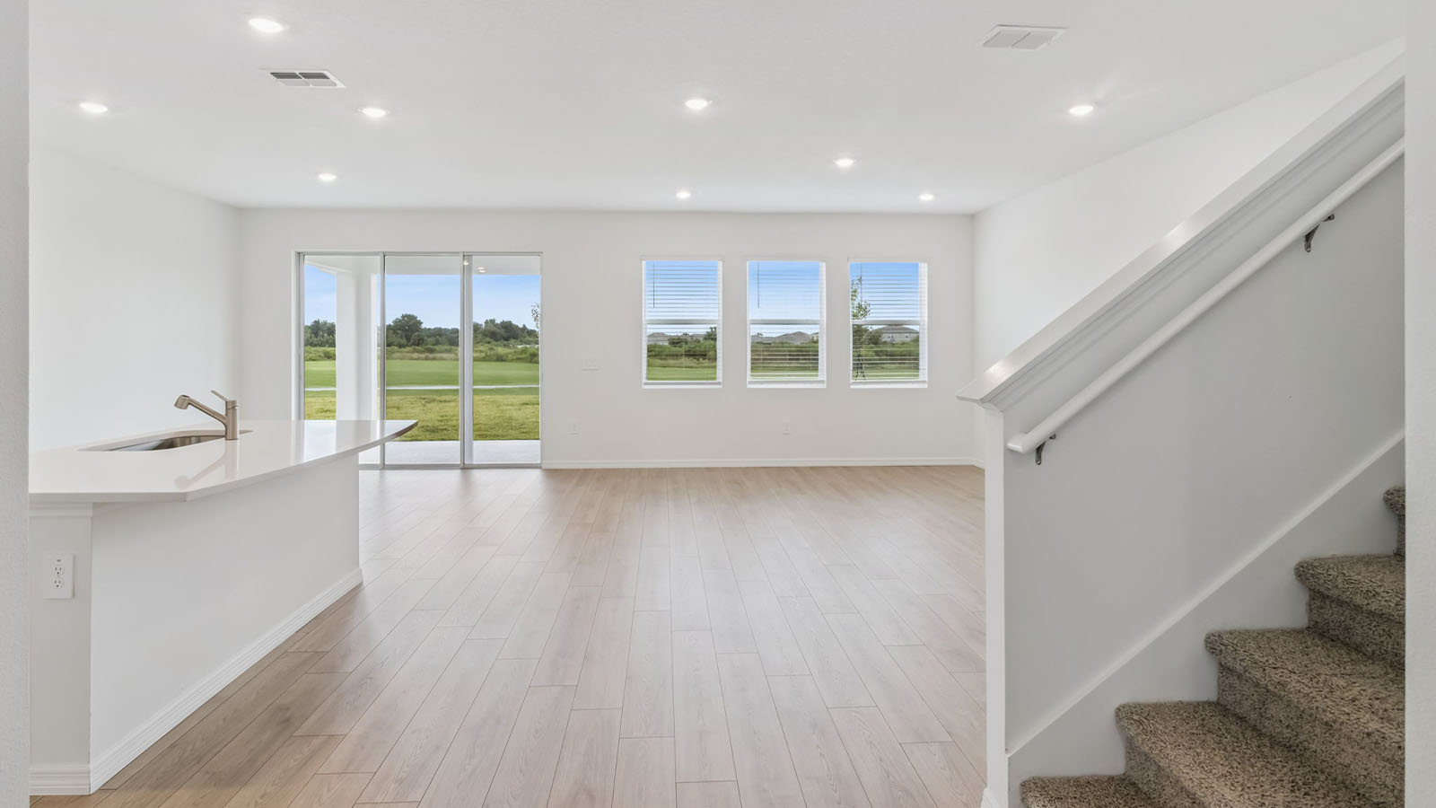 Stairs to second floor and view of the living space