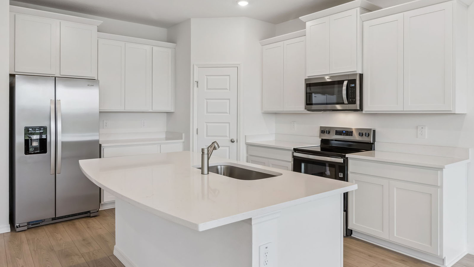 Kichen with quartz countertops and stainless steel appliances