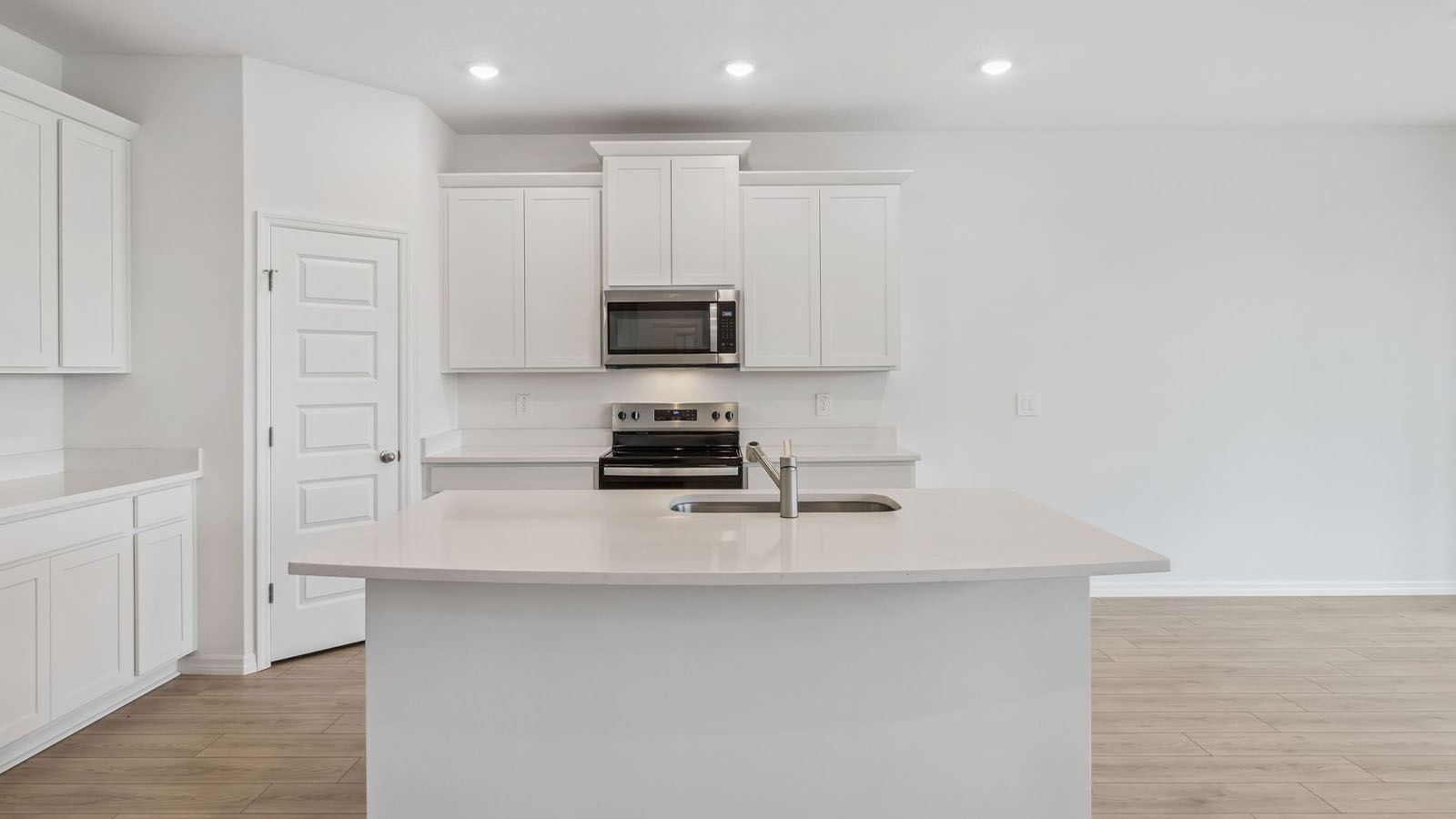 Kitchen with island and white cabinets