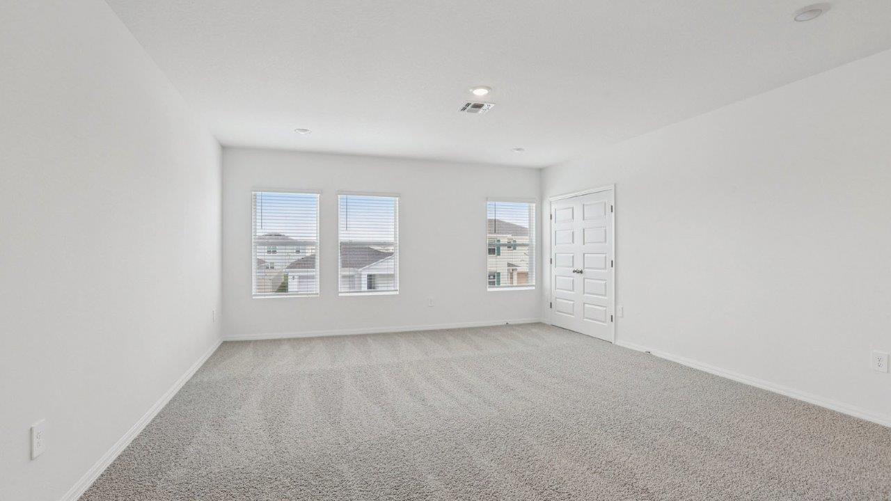 Upstairs loft with carpet flooring