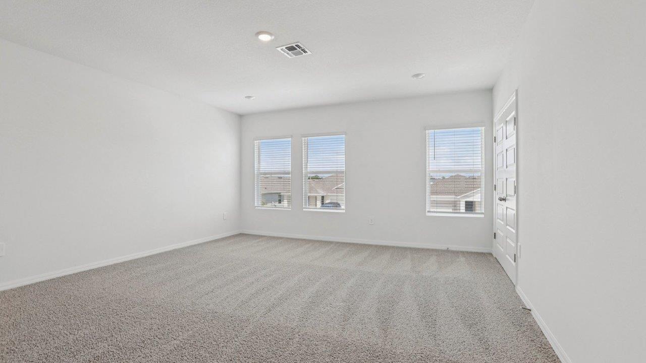 Upstairs loft with carpet flooring