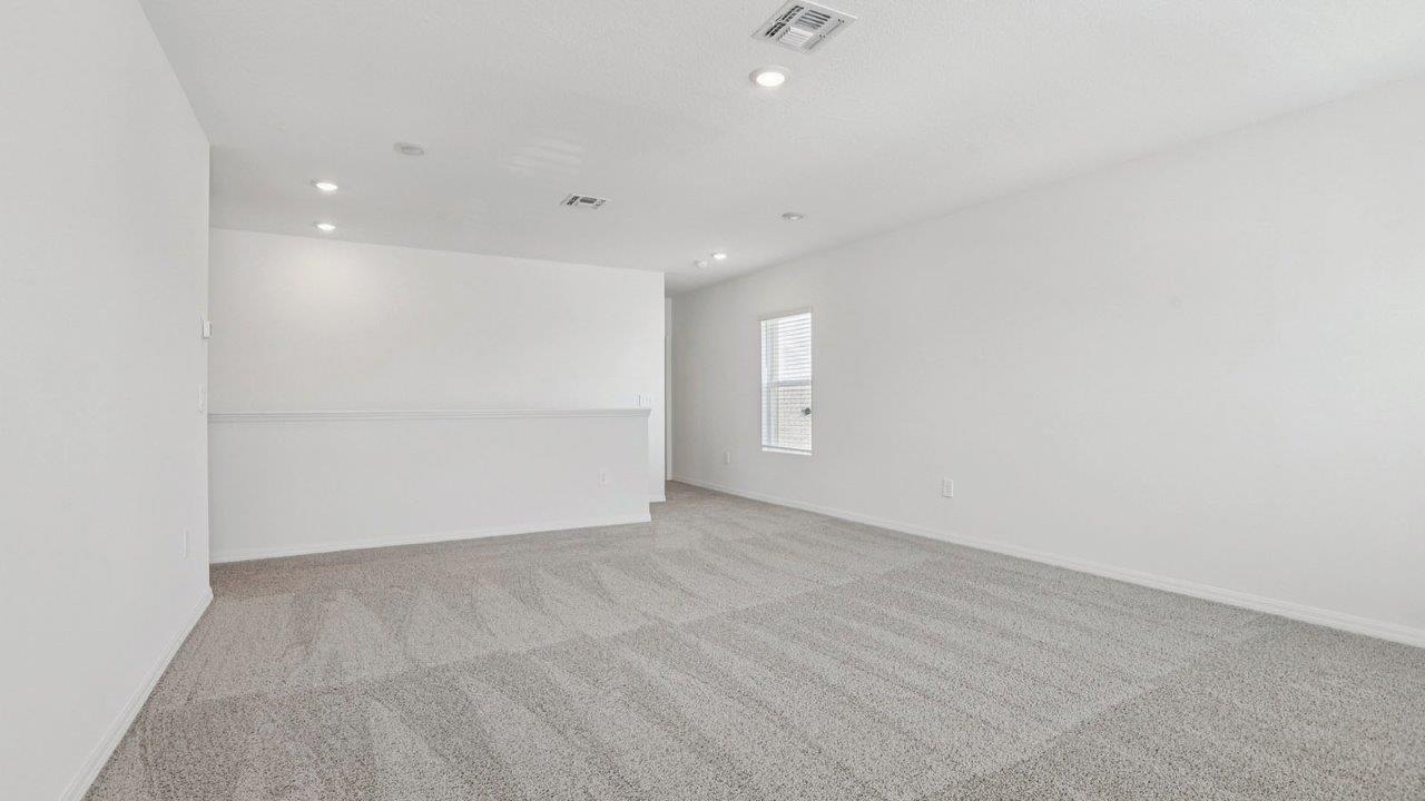 Upstairs loft with carpet flooring
