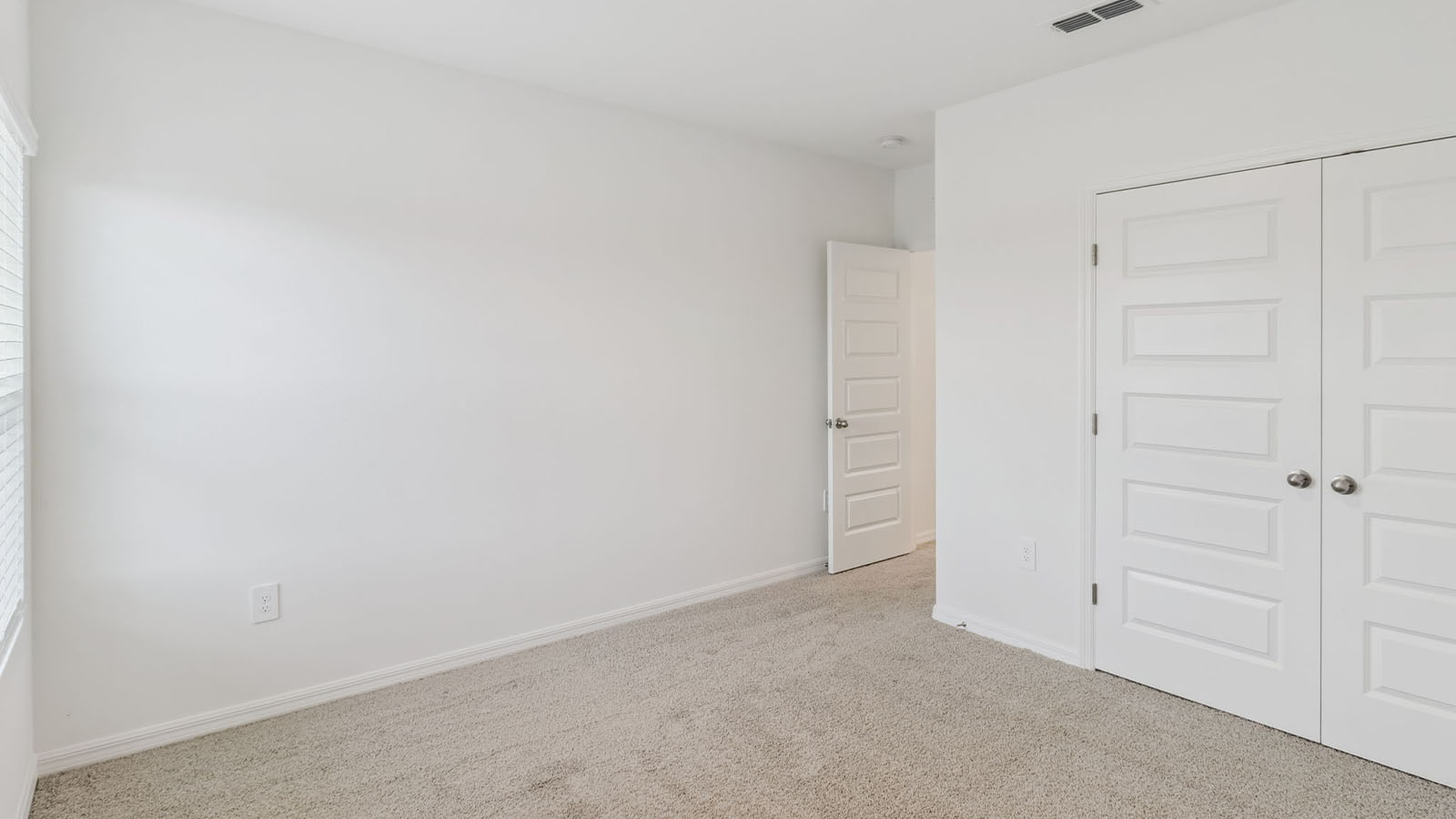 Guest Room with built in closet and carpet