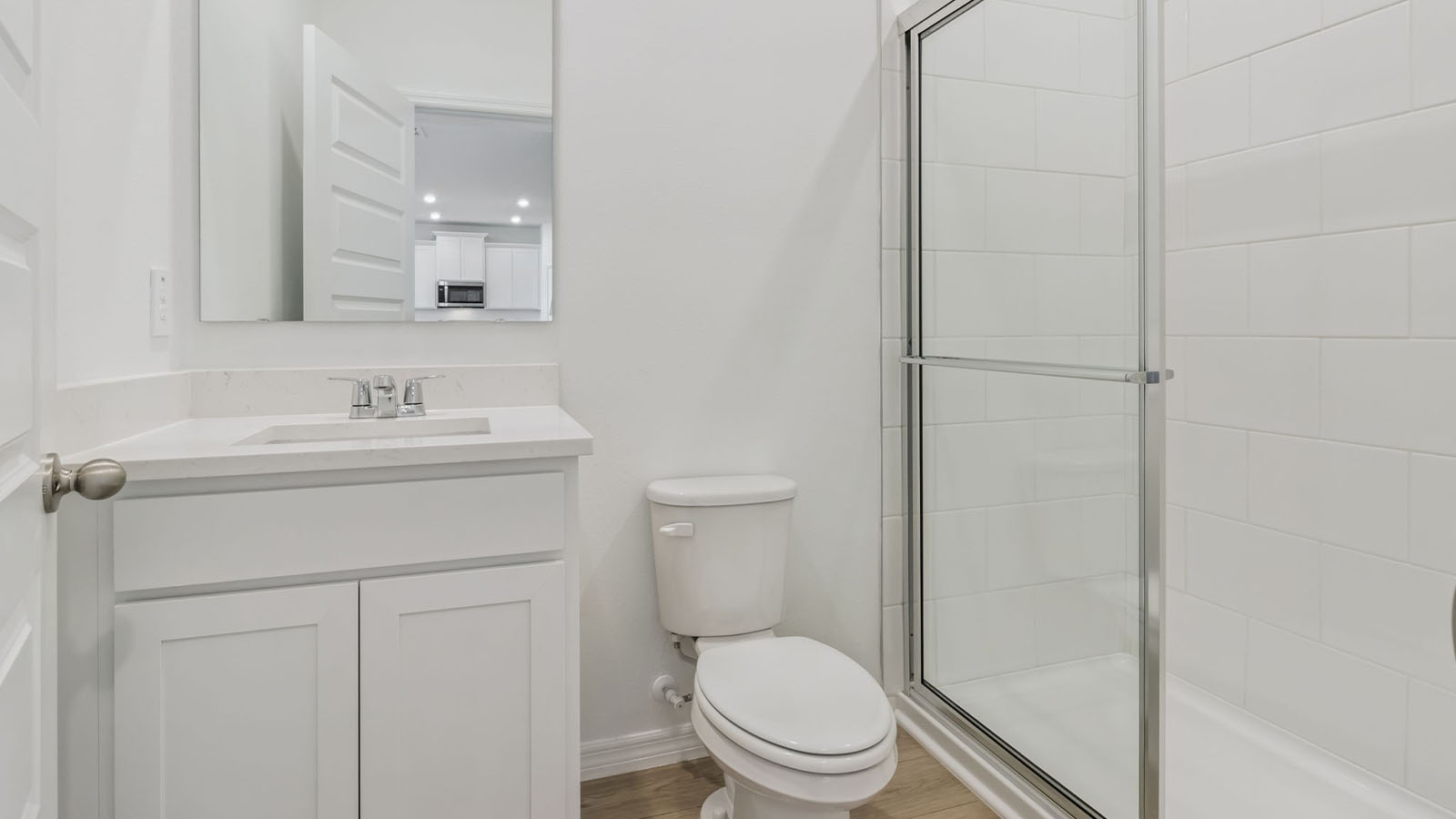 Bathroom with walk in shower and vanity