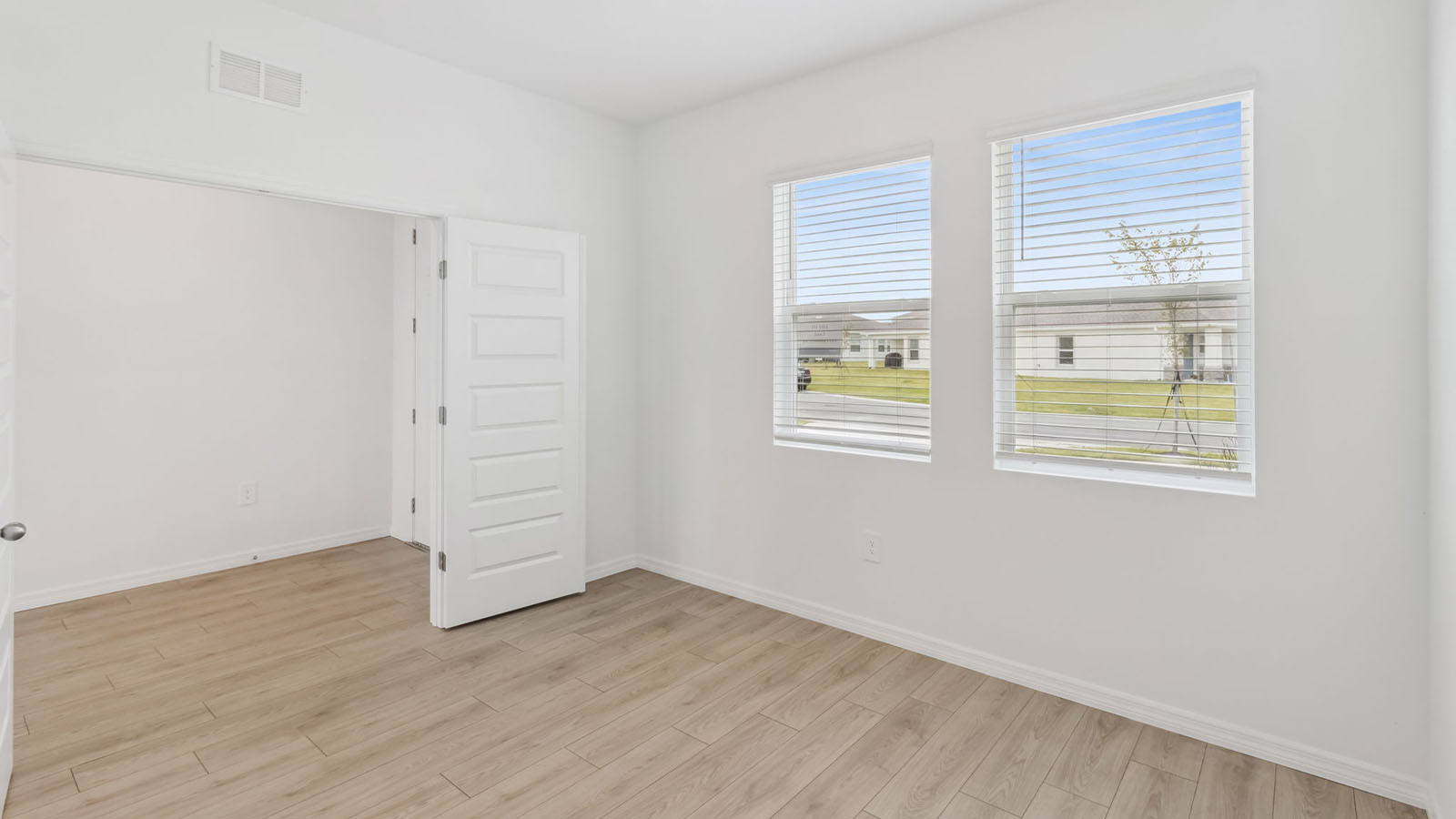 Flex room with french doors and view to front yard