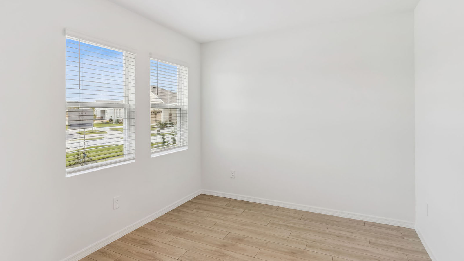 Flex room with windows and RevWood flooring