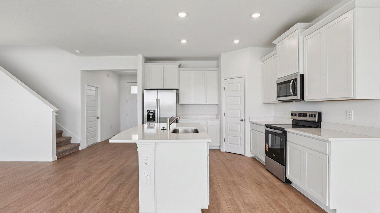 Kitchen adjacent to the stairs
