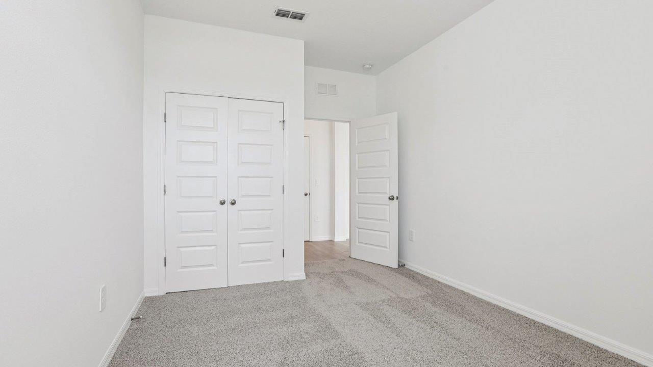 downstairs guest bedroom with carpet