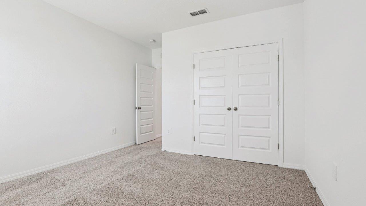 guest bedroom with built in closet