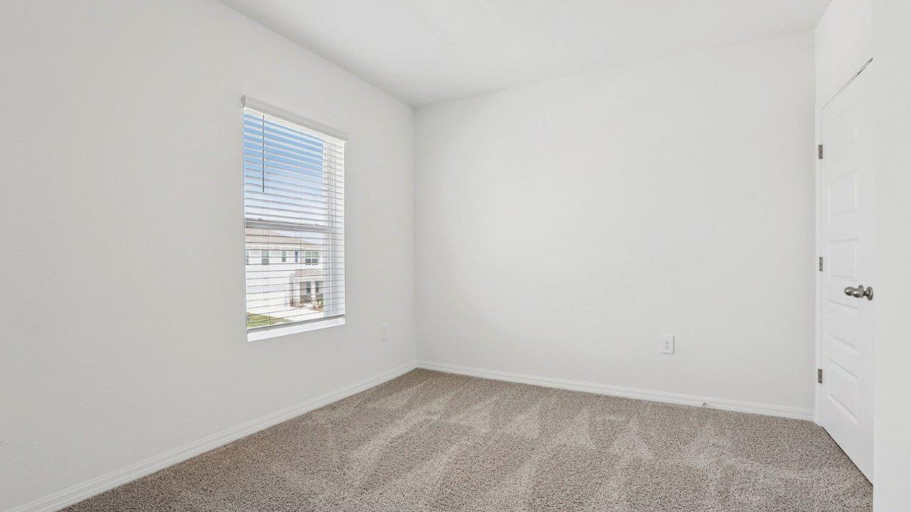 guest bedroom with carpet