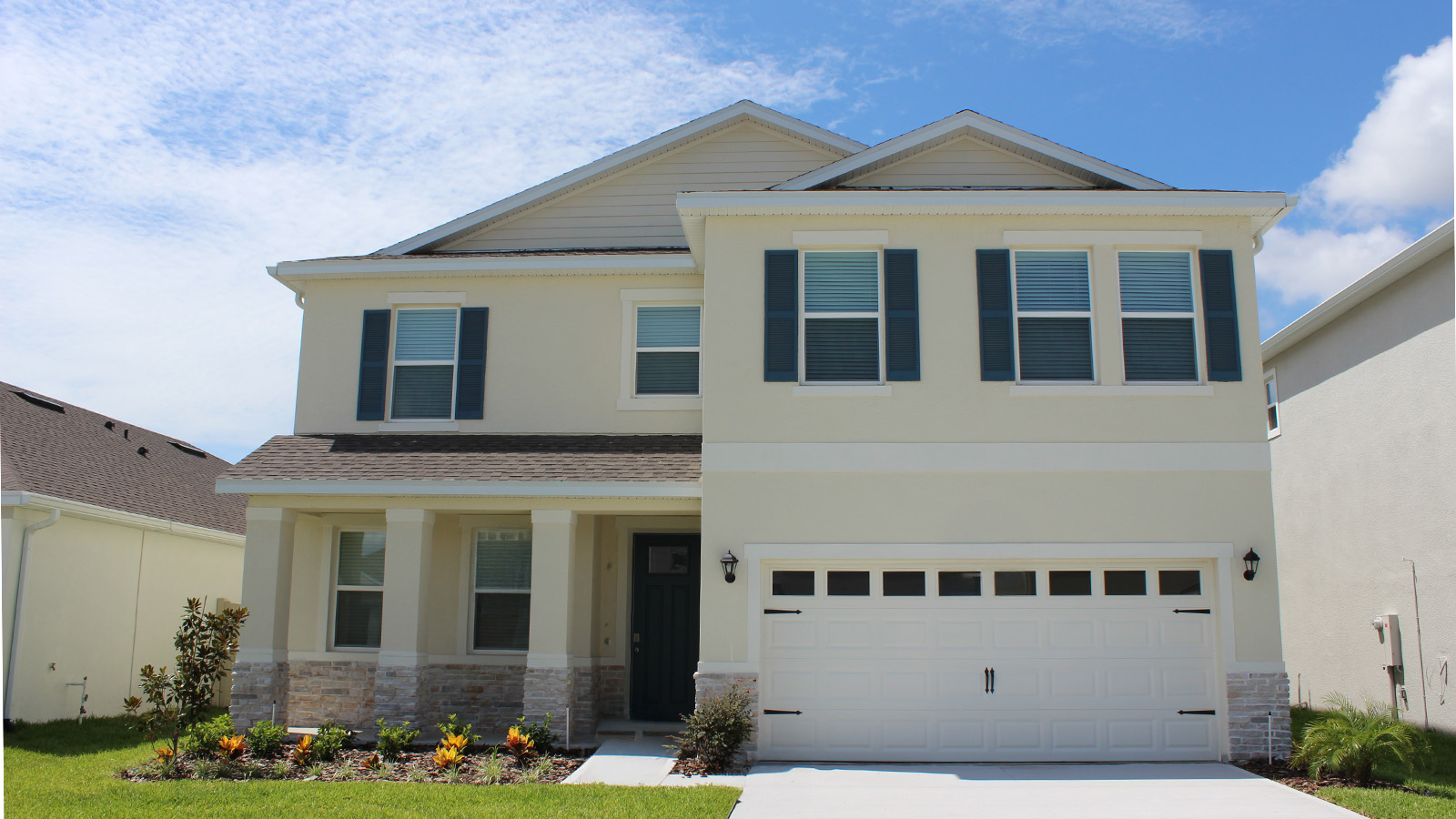 Two story home with stone exterior