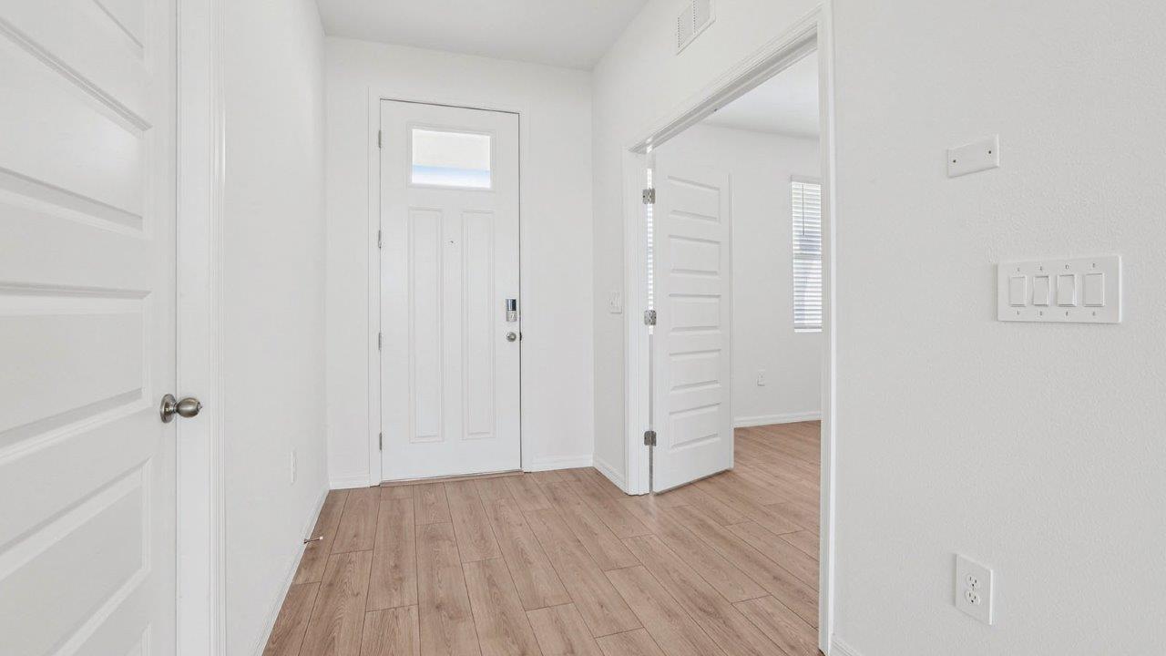 Entry way to the home with revwood flooring