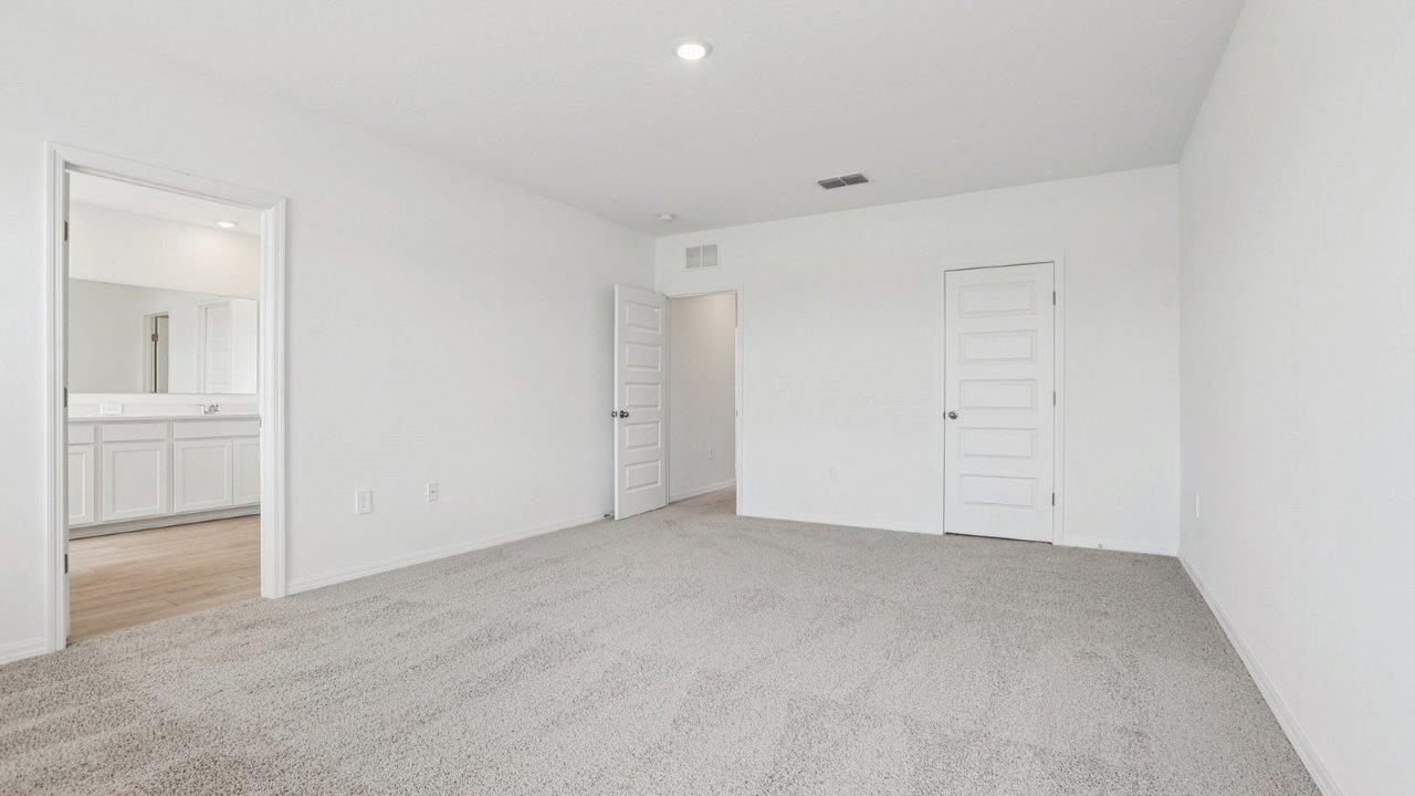 Primary bedroom with a private bathroom
