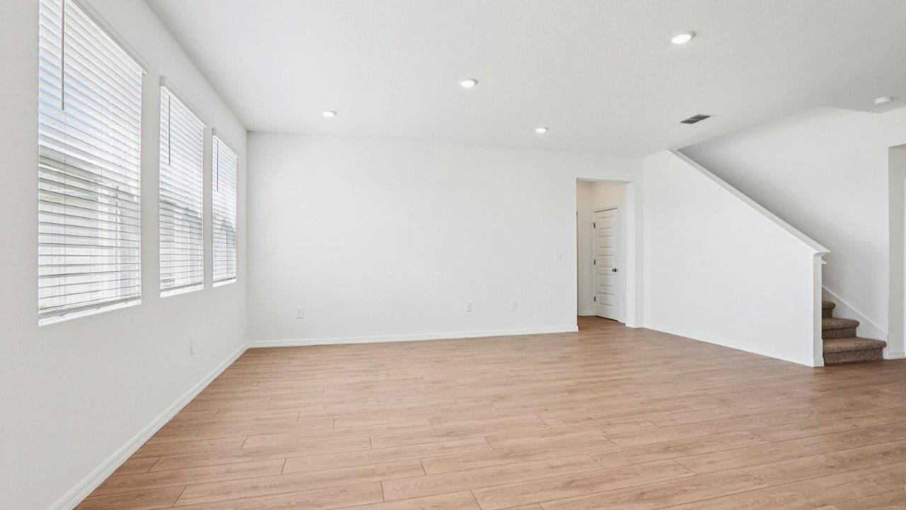 Living Room with Revwood flooring throughout with stairs