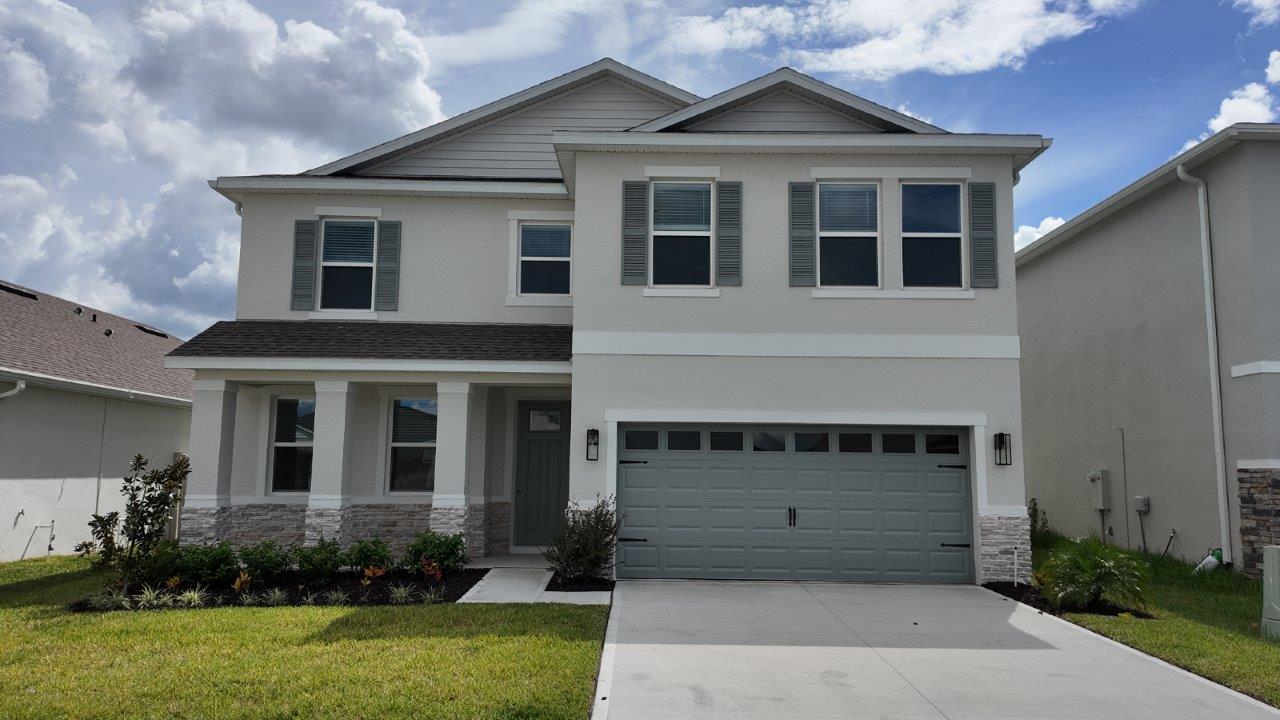 Exterior single family home with two car garage