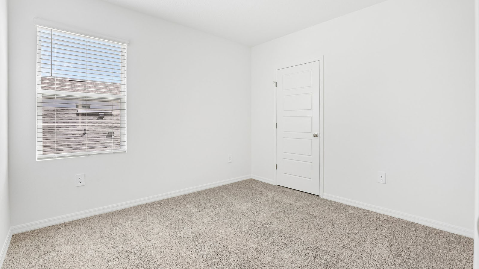 Guest bedroom upstairs with carpet