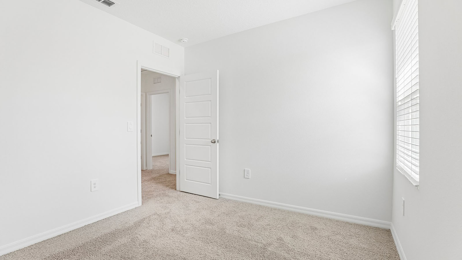 Guest bedroom with carpet