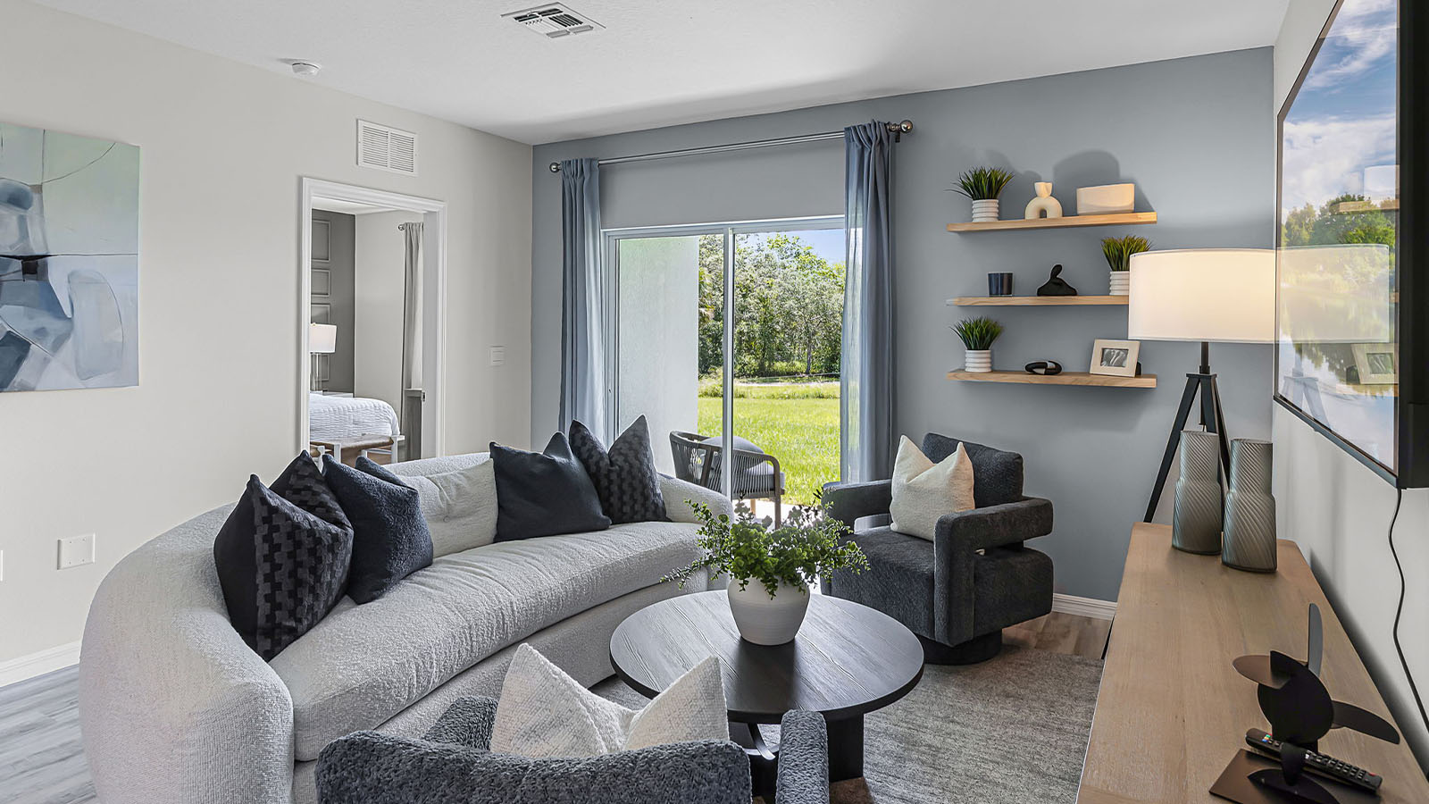 Living room with view of primary bedroom