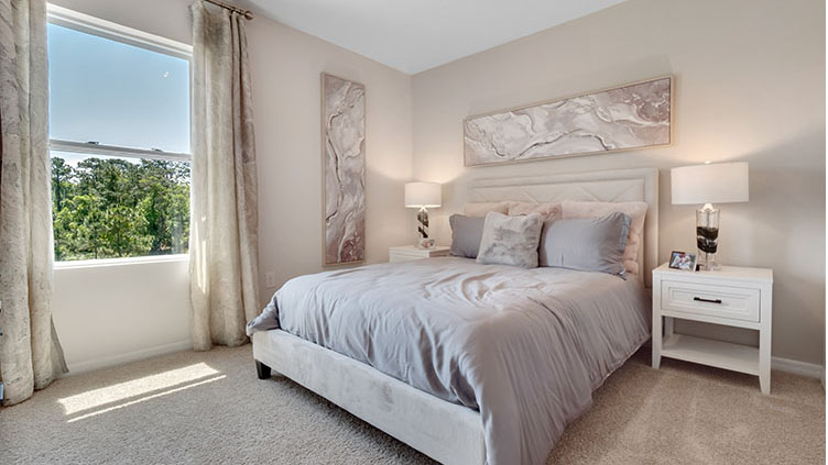 Guest bedroom with carpet throughout the room