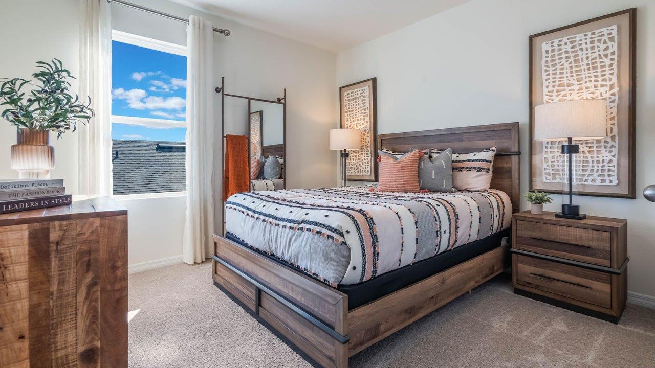 second-floor guest bedroom with queen size bed and carpet flooring