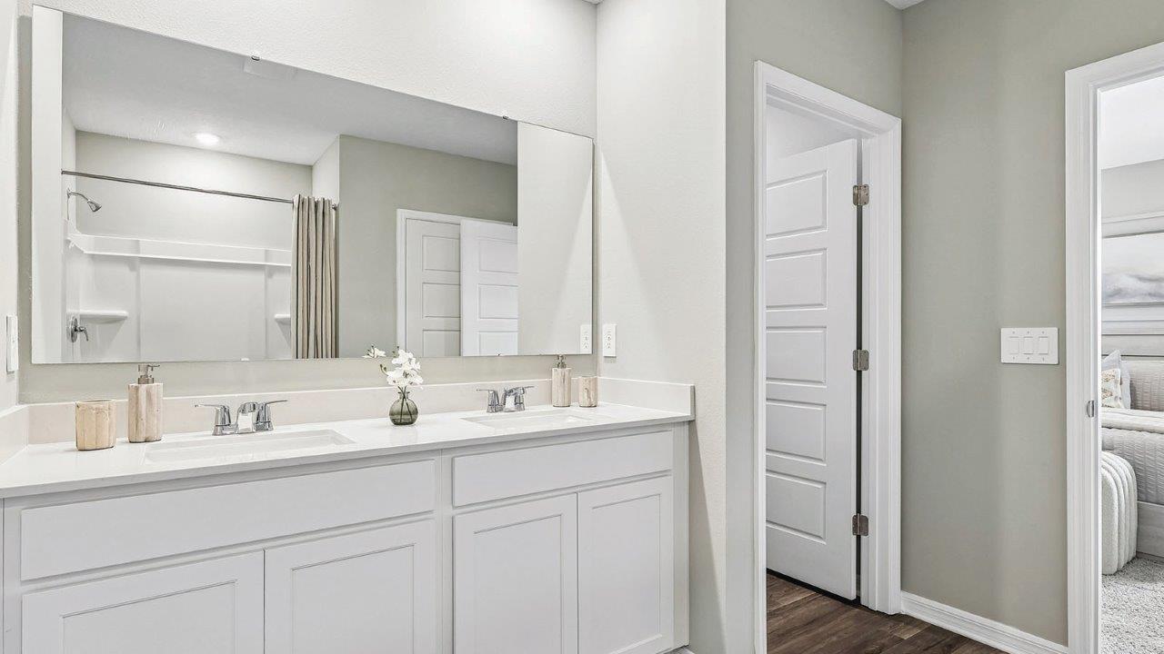 Primary bathroom with dual vanity sink