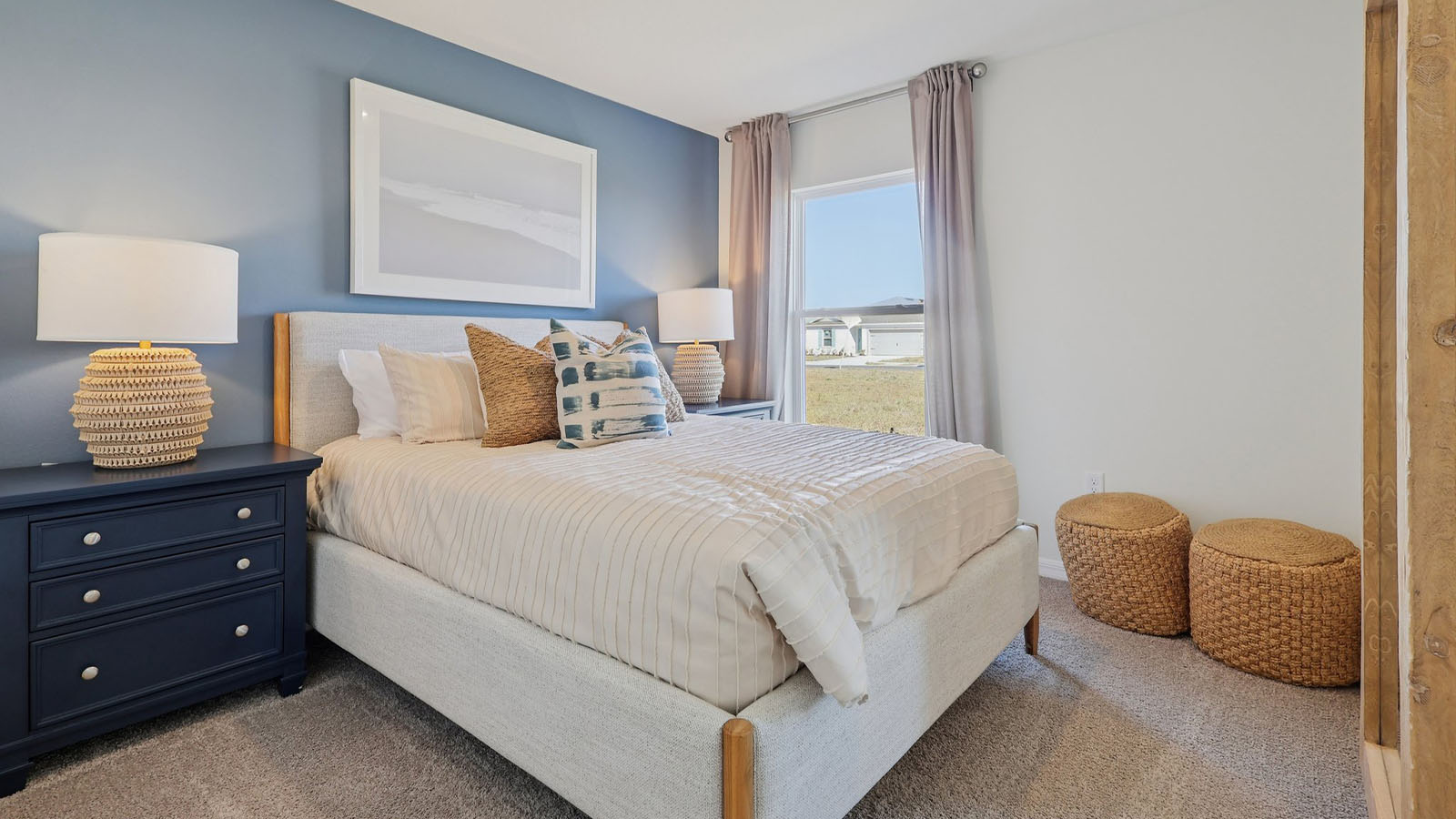 Guest bedroom with queen size bed, window and mirror