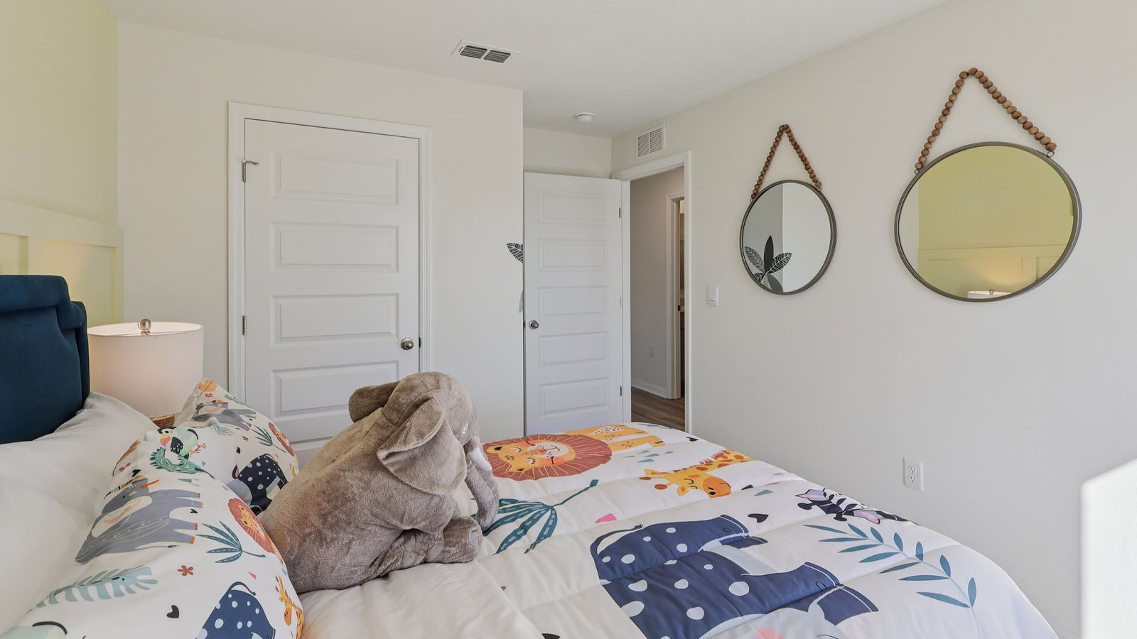 Guest bedroom with full size bed and young child decor