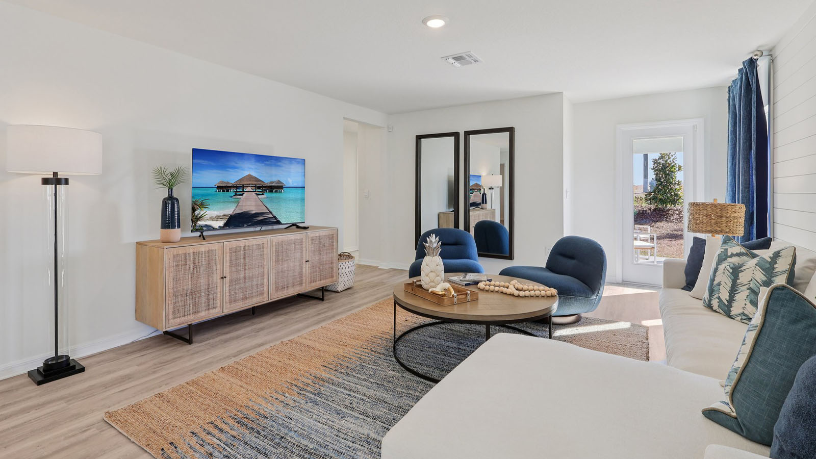 Spacious living room with couch and additional chairs